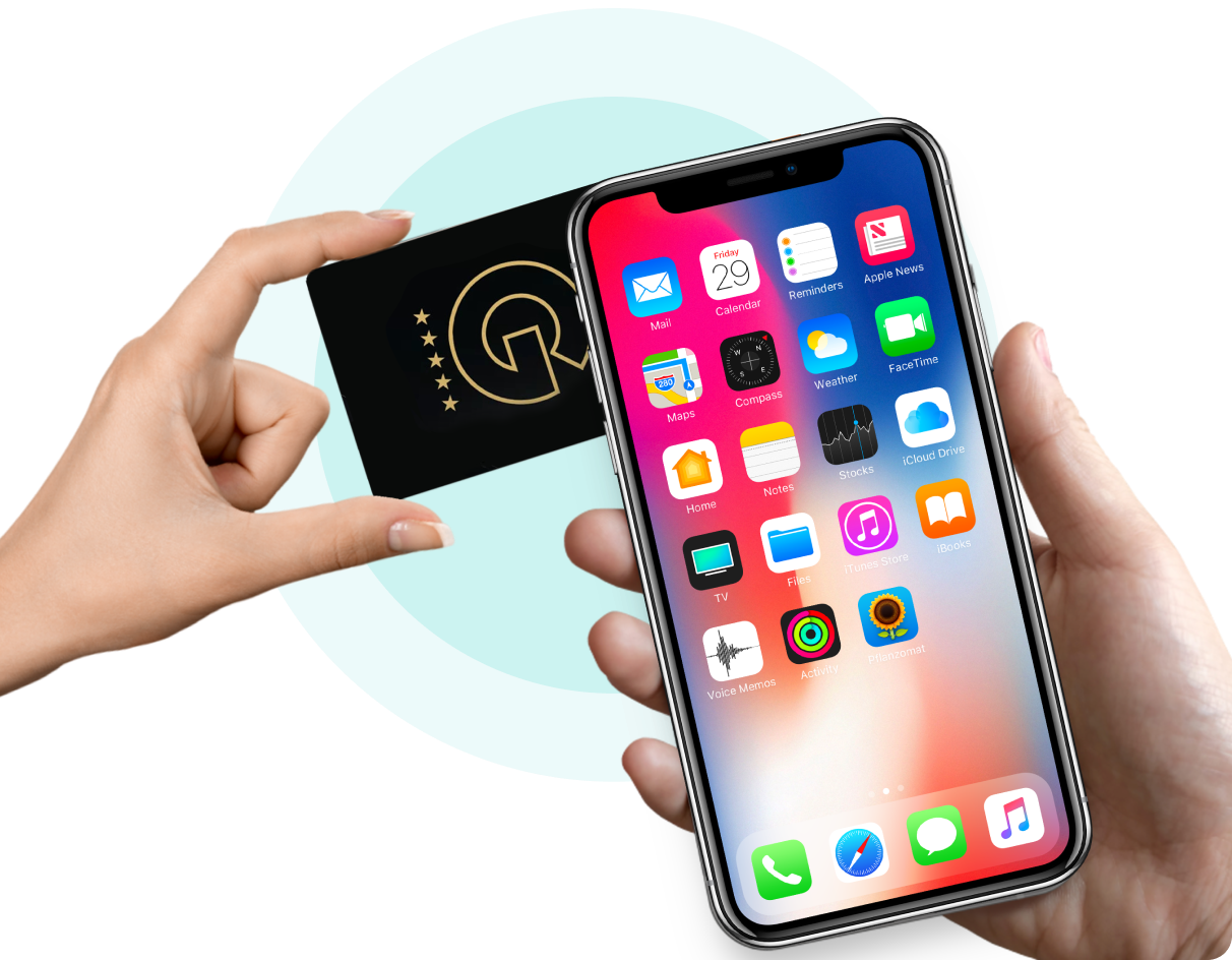 Smartphone with app icons held by a hand, with a blurred background